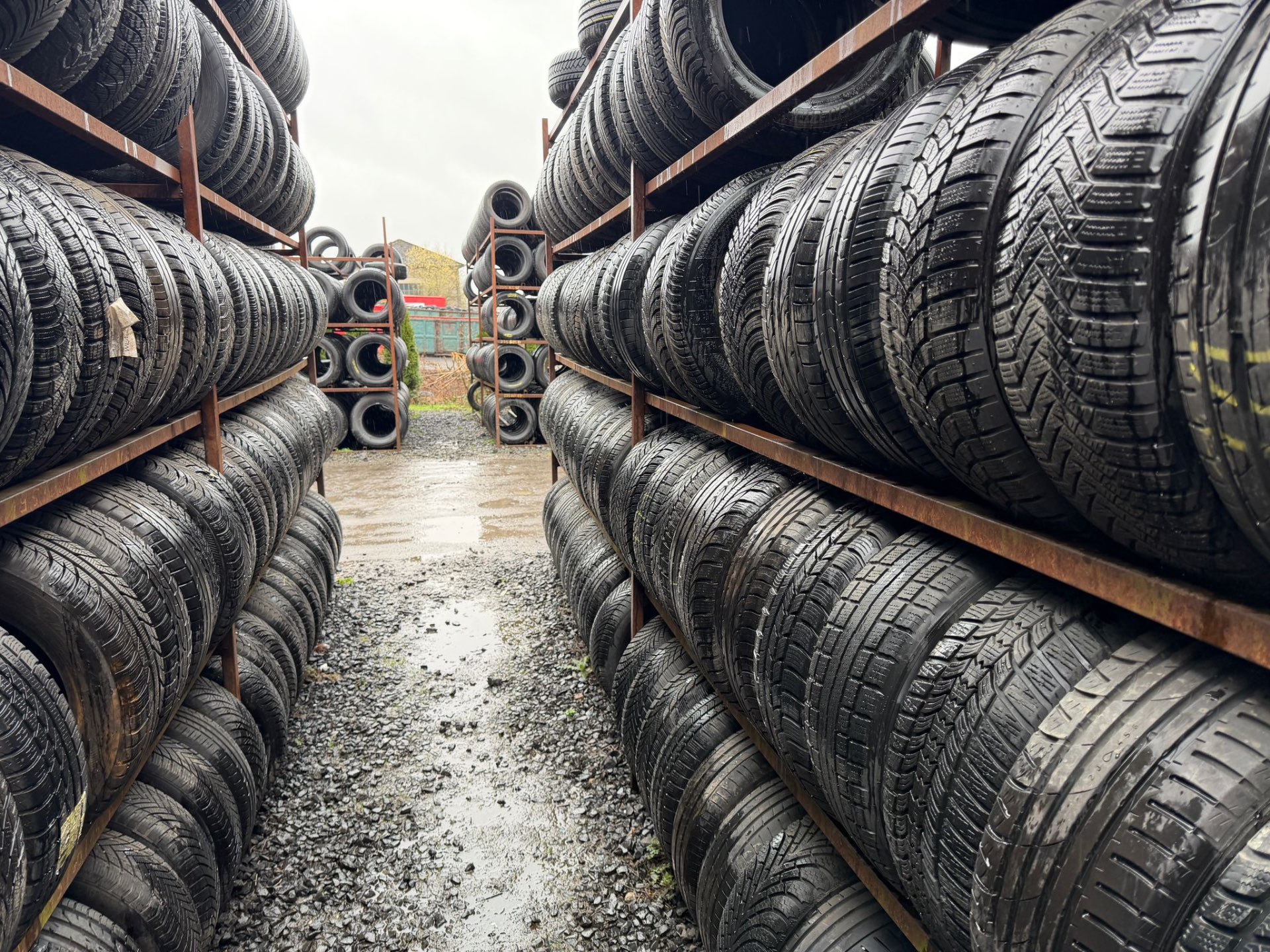 Racks of part worn tyres at the A2Z Tyre Recycling yard