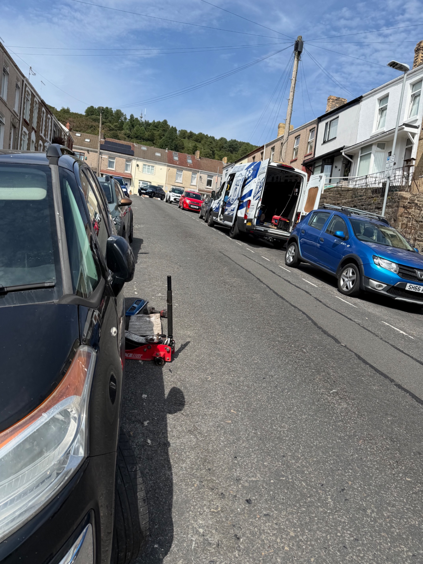 A2Z van replacing a tyre on a terraced street