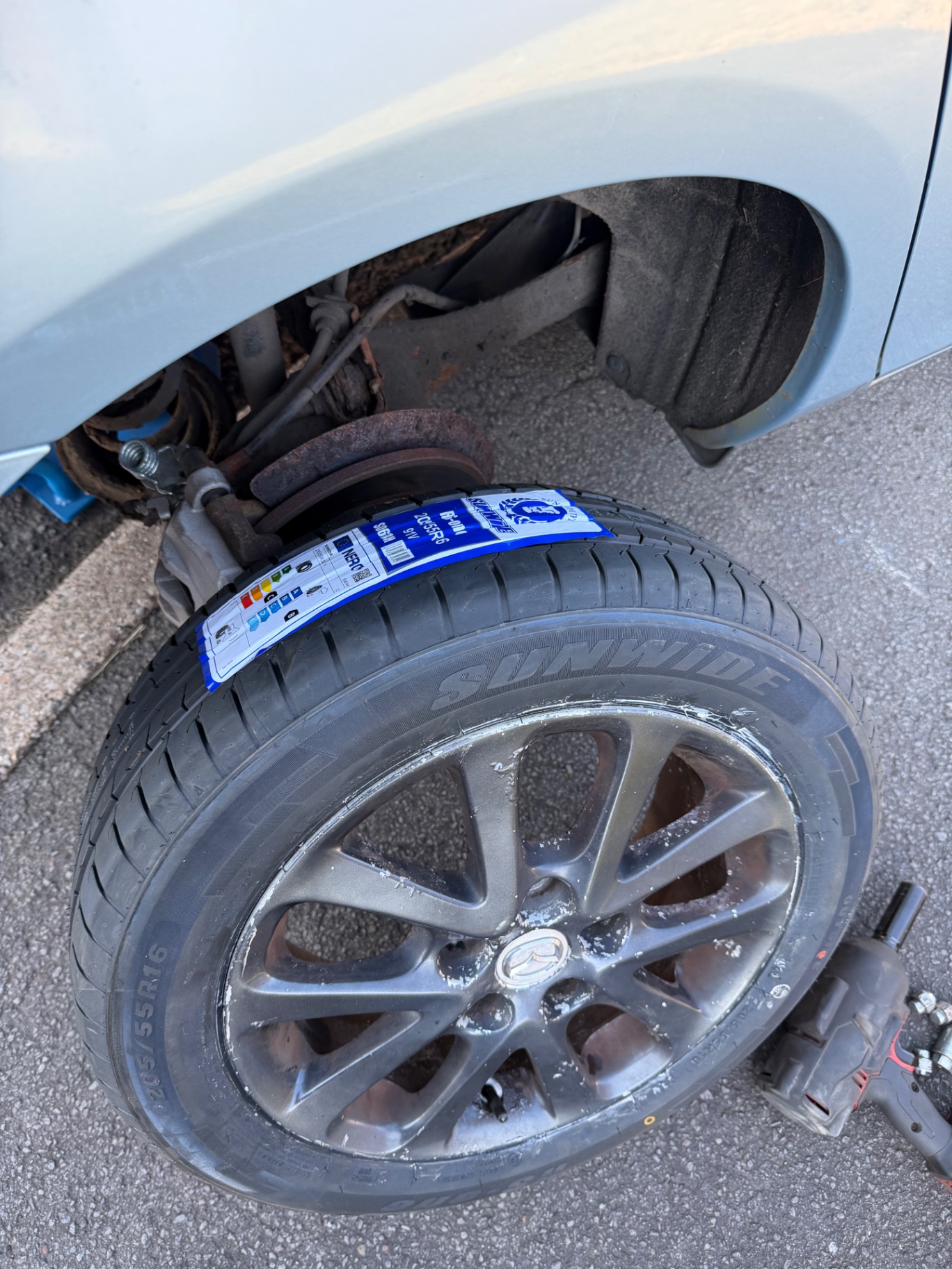 New tyre fitted to an alloy wheel on the roadside